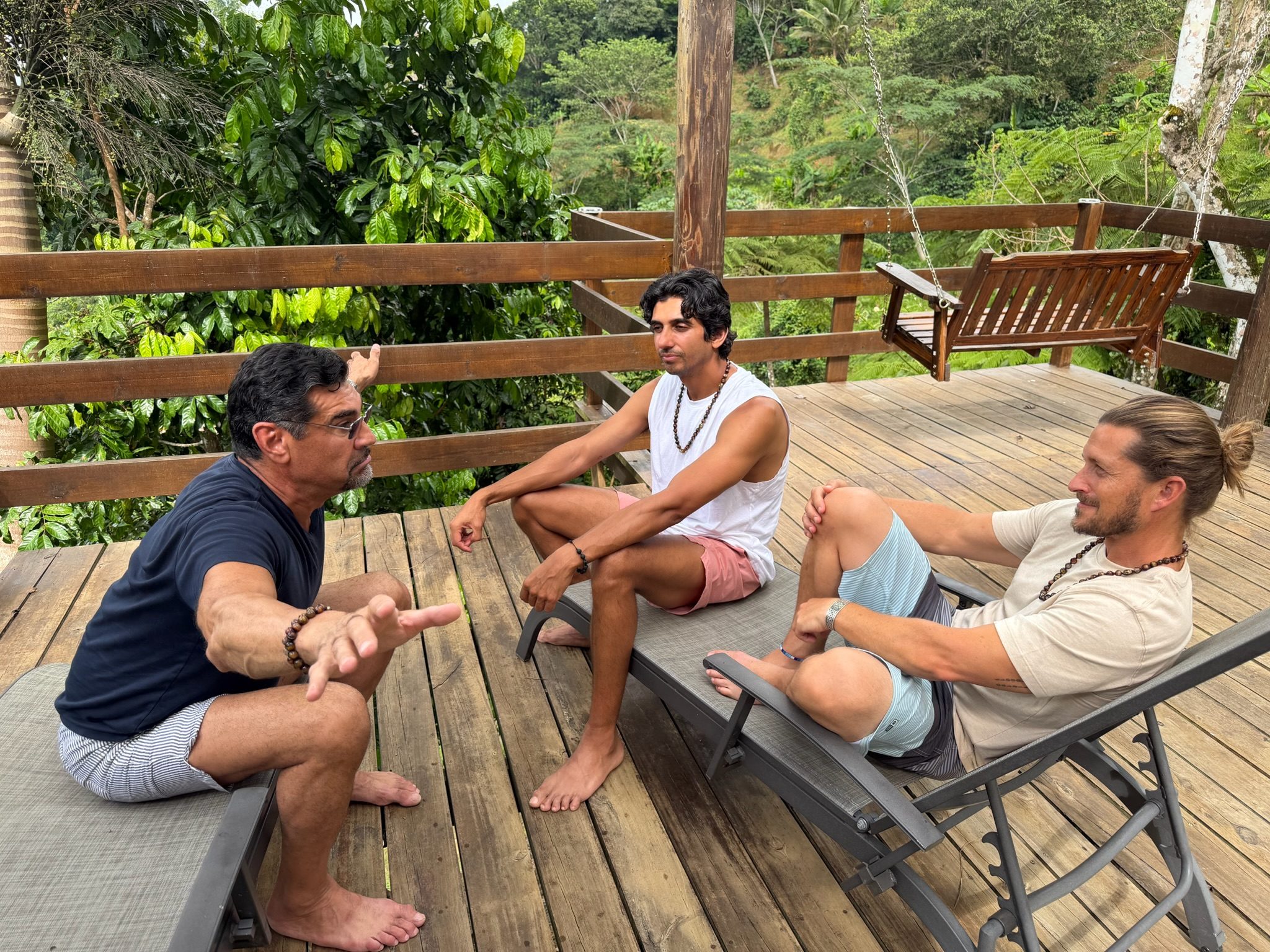 Community gathered at a long outdoor table for dinner and conversation